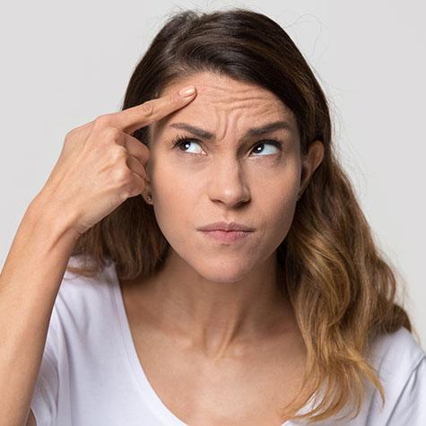 woman thinking about BOTOX