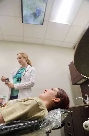 Dental patient receiving 3 C C T cone beam digital x ray scan in Houston dental office